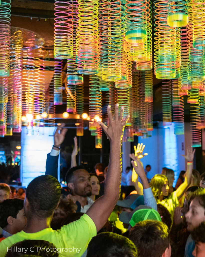 Creative ceiling decor with colorful slinkies for a Mitzvah in Westchester.