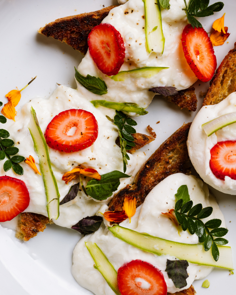 Strawberry and burrata crostini for upscale cocktail party catering in NYC.