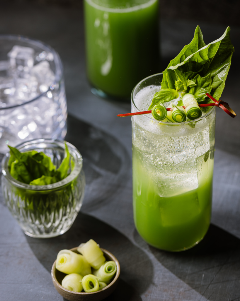 Signature green herb cocktail served at a luxury catering New York event.